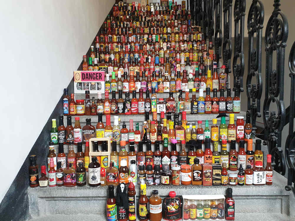 Lined up all my hot sauce collection on the staircase in my building